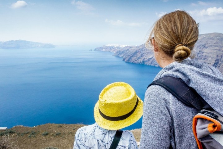 a person standing in front of a mountain
