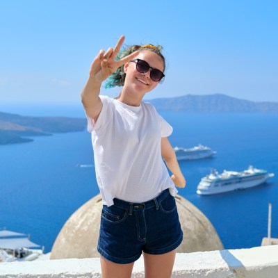 a person standing next to a body of water